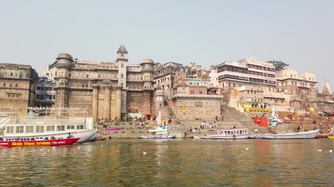 varanasi , India - 02 18 2022: View of Varanasi's Ghats from a Tourist Boat Cruising on Ganga River, India