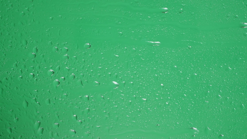 Water rainfall, rain drops falling on window glass over chroma key green screen | Shutterstock HD Video #1087682372