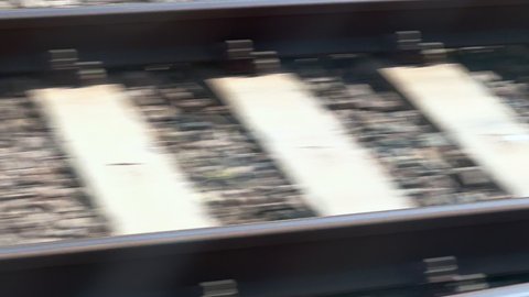 Motion-blur footage from a moving train over the railway tracks