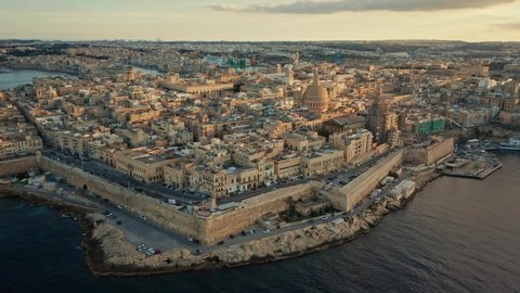 Aerial, view of Valletta city - capital of Malta. Sunset, aerial view, main church, dome, evening, sea