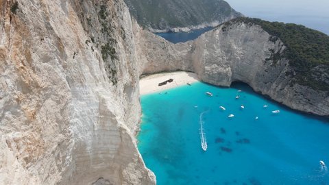 Aerial flight over the Navagio bay and Ship Wreck beach in Zakynthos island, Greece. The world's most famous Mediterranean beach