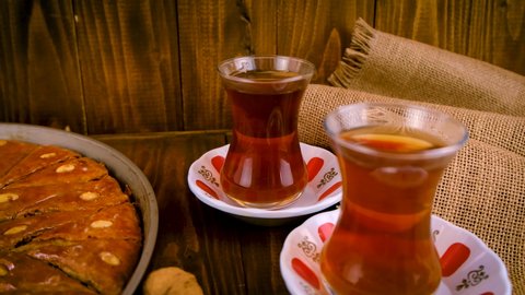 Baklava and Turkish tea on the table. Selective focus.