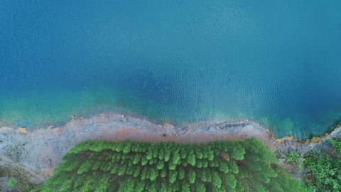Aerial view lake or pond Amazing view of beautiful fresh and virgin nature in sunny good weather day High quality video from Drone camera Top down beautiful water surface