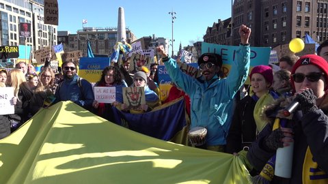 AMSTERDAM, NETHERLANDS – FEBRUARY 27 2022: Ukrainian diaspora and others chant slogans during solidarity manifestation with the Ukraine. Anti-war rally after Russian invasion.