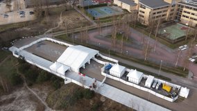 Aerial drone view of COVID-19 drive through street were healthcare organization test for coronavirus disease is a contagious sickness caused by severe acute respiratory syndrome 4k high resolution - Powered by Shutterstock - Get 15% off with code: PIKWIZARD15