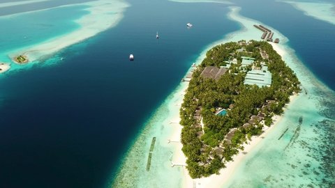 Aerial drone view of a beautiful resort island in the Maldives, Ari Atoll