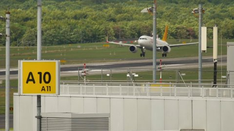 DUSSELDORF, GERMANY - JULY 23, 2017: Airbus A320 Fly Pegasus landing in Dusseldorf, slow motion. Tourism and travel concept