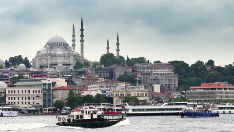 Istanbul, Turkey - 14 Mar, 2020: View of the Suleymaniye Mosque and fishing boats in Eminonu, Istanbul, Turkey