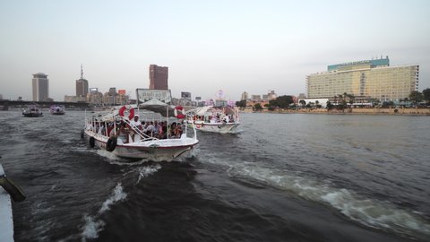 Cairo, Egypt - 22 May, 2021: Tourists enjoy panoramic view of Cairo on boat tour on Nile river