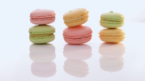Macarons cakes of different colors on white background. Culinary and cooking concept. Tasty colourful macaroons
