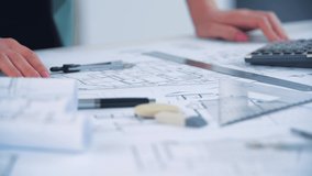 4k video of close up engineer hand sketching a construction project.