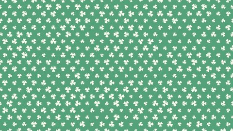 St. Patrick's animated clovers against a green background. For use as a general backdrop, design element or as an overlay for placement of text or other copy.