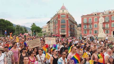France, Nice, 04 August 2018: Pink Parade in support of people of non-traditional orientation on the main streets of the French Riviera, cheerful people flags of the LGBT community, musical truck