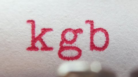 Macro shooting of typewriter red letters "KGB" on paper
