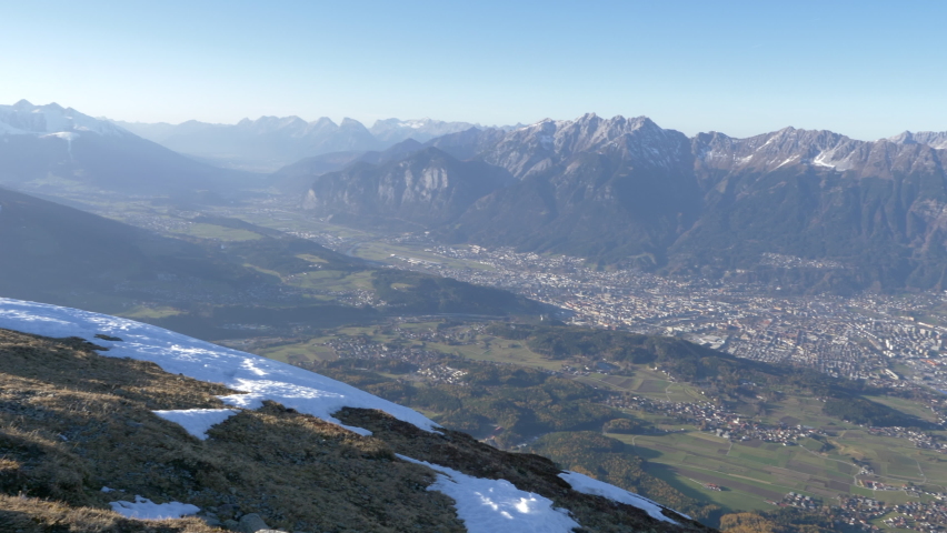 Beautiful landscape of Innsbruck city in Lower Inn Valley, Austria. Pan right, high angle