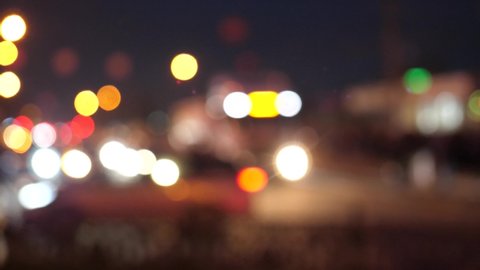 Blurred moving cars, bokeh traffic city street lights at night,