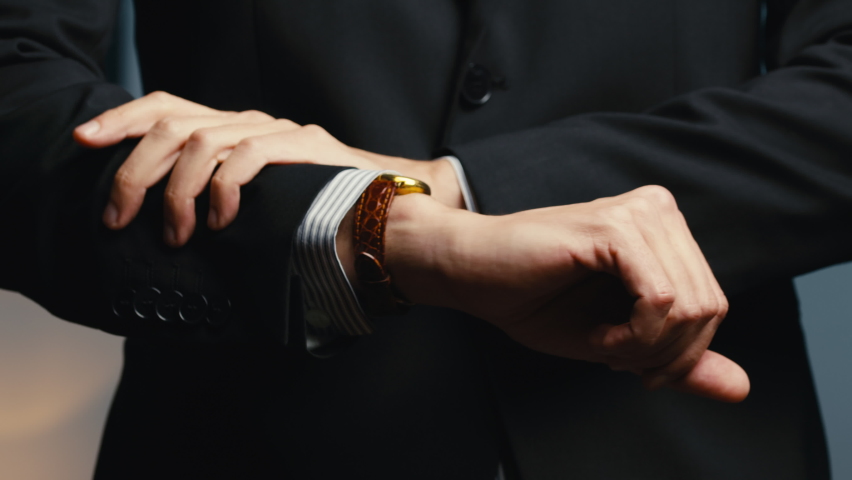 well dressed man prepares to fight
