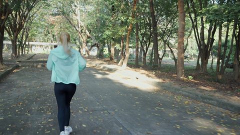 Woman jogging exercising running cardio workout.