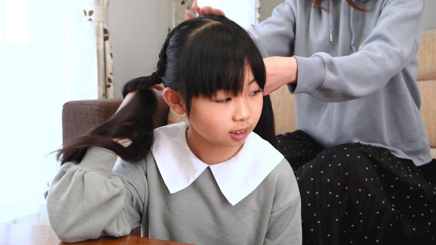 Asian family relaxing at home