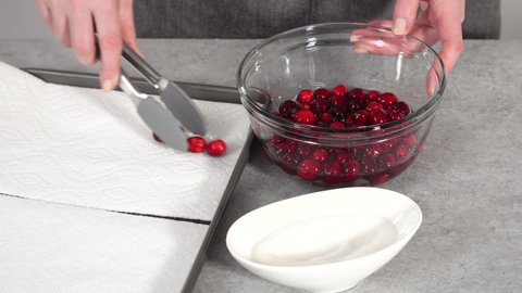 Step by step. Prepating sugar cranberries with organic cranberries and white sugar.