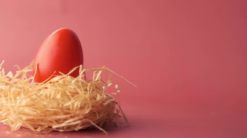 easter concept with red color egg on a red background 