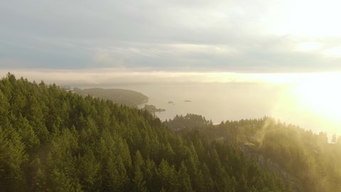 Aerial panoramic view of Sea to Sky Highway in Horseshoe Bay during a sunny winter sunset. Taken in West Vancouver, British Columbia, Canada.