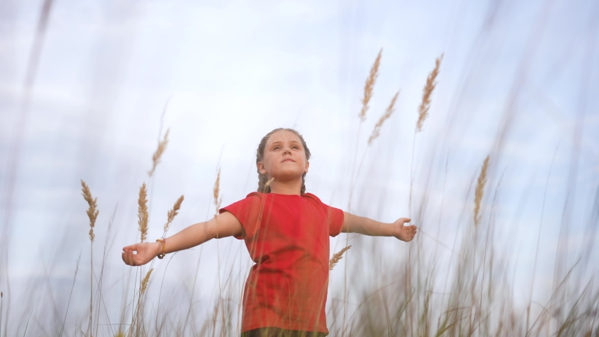 kid pray. pulls hands against a sky. child girl concept faith religion and happy family. kid girl pray hands to the side against sky jew kid praying to god. worship lifestyle and gratitude religion Royalty-Free Stock Footage #1087764680