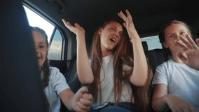 children teenagers dancing in the car on the road travel. happy family adventure a kid dream concept. friendly family sisters dancing fun having to the music in the car on the way to vacation - Powered by Shutterstock - Get 15% off with code: PIKWIZARD15