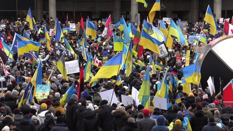Toronto, Ontario, Canada February 27 2022 Crowds of patriotic people in anti war protests in support of Ukraine amid Russian invasion