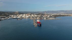 Aerial drone video of Public Hellenic crude oil and gas refinery plant in industrial area of Elefsina, Attica, Greece