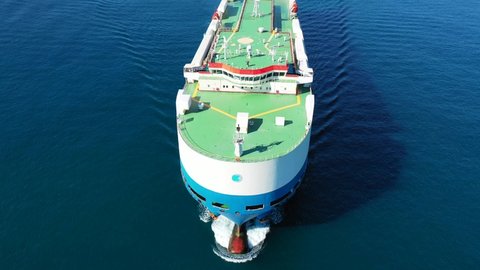 Aerial drone video of huge car carrier ship RO-RO (Roll on Roll off) cruising in Mediterranean deep blue sea