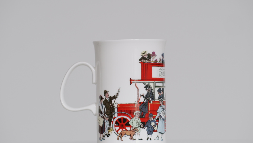 Rotating London mug on the turntable - stock video