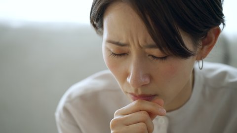 Asian woman in poor health