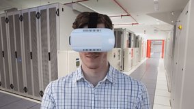 Animation of caucasian businessman wearing vr headset over server room. global connections, technology, data processing and digital interface concept digitally generated video.