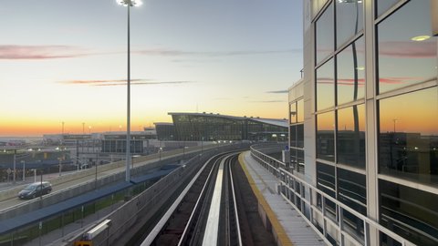 NEW YORK, USA - OCTOBER, 24, 2021: Riding airtrain in JFK airport terminal. Railroad, train driving on rail, approaching station. Monorail automatic car. Subway public transport. 