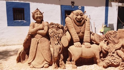 Albufeira , Portugal - 07 01 2021: Pan shot of a Sand Sculpture (Shrek) at Albufeira, Algarve, Portugal