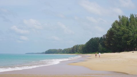 Beach space area background. Sea nature white sand with blue sky. People walking on beach trees background summer. Travel tourists island relaxing honeymoon lifestyle.