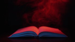 Red smoke billows over an old open book and a glowing inscription war appears. - Powered by Shutterstock - Get 15% off with code: PIKWIZARD15
