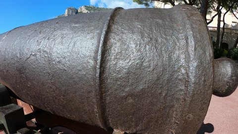 DOLLY SHOT SLOW MOTION - Old cannon at the Prince's Palace of Monaco. Monaco is a sovereign city-state and microstate, located on the French Riviera in Western Europe. Cannon aiming at the sea.