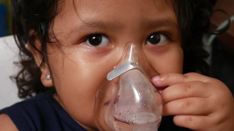 Indonesian girl is being nebulized to cure her respiratory tract