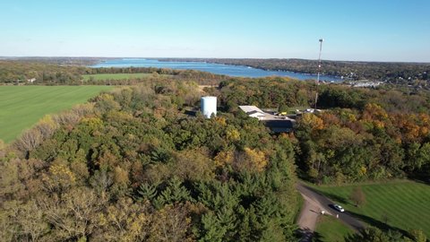 Aerial View of Fontana-on-Geneva Lake, Wisconsin USA. Green Landscape, Forest and Lakeside on Sunny Autumn Day, Pedestal Drone Shot