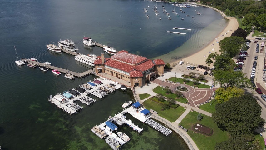 Aerial View of Riviera, Lake Geneva, Wisconsin USA. Boat House, Docks and Beach of Resort City on Sunny Day, Drone Shot