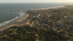 Punta del Diablo beach and village at sunset, Uruguay. Aerial drone panoramic view