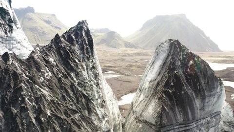 Rock Formations Near Katla Volcano And Myrdalsjokull Glacier In Iceland - aerial drone shot
