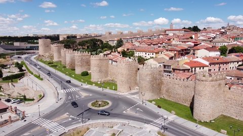 Avila , Spain - 06 19 2021: Avila, Castilië León, Spain - Aerial view of the City Walls, Cityscape and Driving Cars