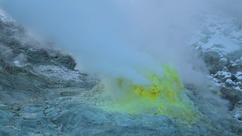 Closeup shot of sulfur gas coming out from the rocky ground of Mount Io, Teshikaga, Hokkaido
