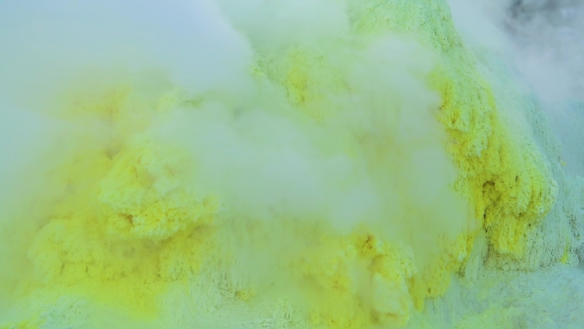 Closeup shot of sulfur gas coming out from the rocky ground of Mount Io, Teshikaga, Hokkaido