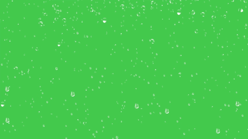 Rain drops trickling down on green background. Rain Drops Stock Footage in 4K. Droplets of water on green glass background.