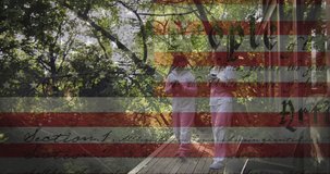 Animation of american flag and constitution text over asian mother and daughter in garden. american patriotism and independence concept digitally generated video.