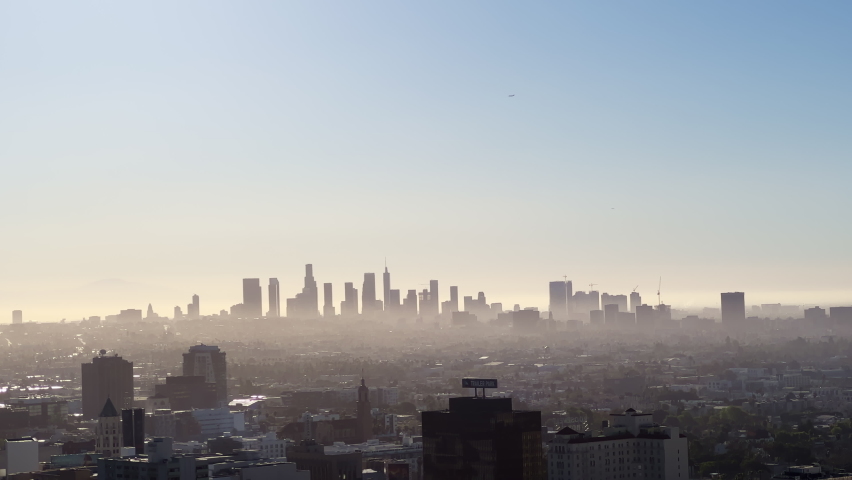 Downtown Los Angeles Sunrise over the city, close-up on silhouettes of modern buildings in downtown Los Angeles. 4K UHD